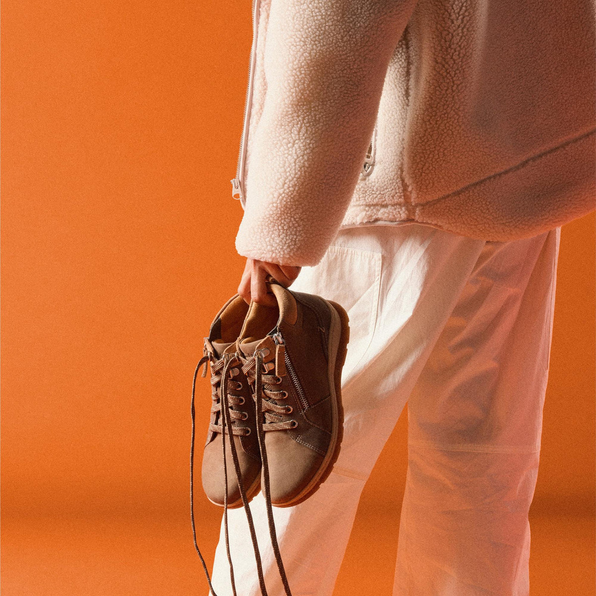 Clarks Orlene Top in Dark Sand nubuck, carried in hand - Shoetopia Footwear
