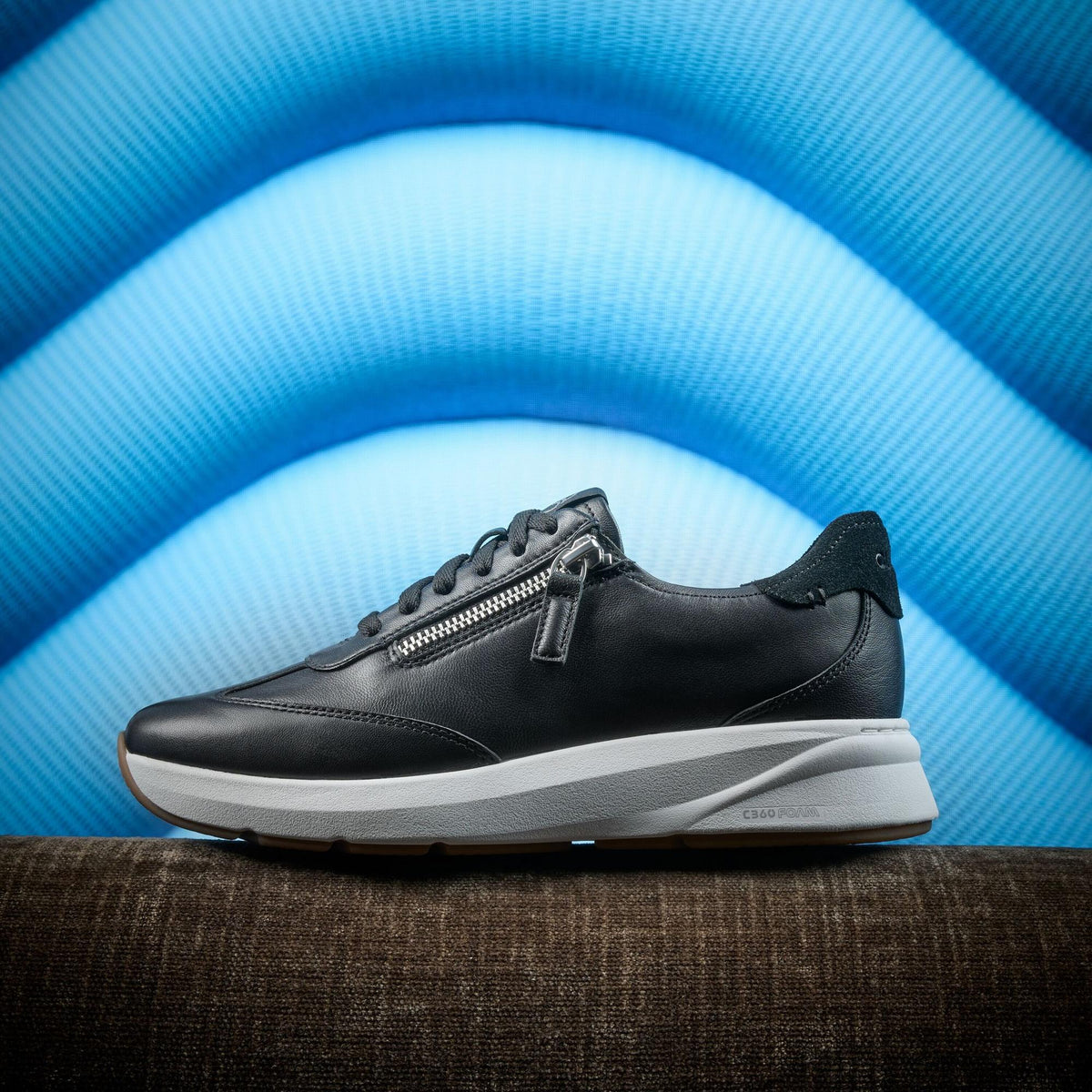 Clarks Code R Run in black leather, styled lifestyle shot - Shoetopia Footwear
